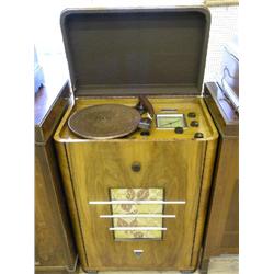 A 1930's GEC walnut console radiogram, with Garrard Bakelite pick up and Art Deco style chrome plate