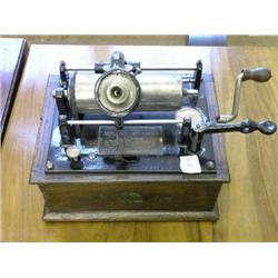 An early 20th century Edison Bell 'Gem' phonograph, in oak case with aluminium horn, reg. no. 27473,