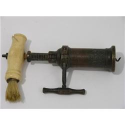 An early 19th century bronze Heeley & Son kings rack corkscrew, with bone handle and brush  