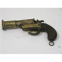 A Webley and Scott Ltd. flare gun, with flared brass barrel and two piece wooden handle, 10ins  