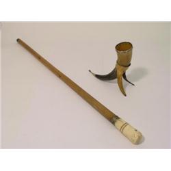 A bone handled malacca walking cane, 36.5ins and a metal mounted horn cup on stand, 12ins  