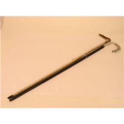 A horn handled walking stick, with striped shaft and another with a white metal horse head handle  