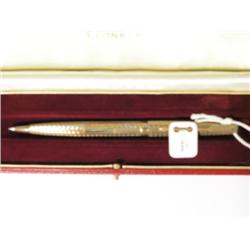 A Parker 9ct gold 'Presidential' ballpoint pen, with engine turned chevron finish in red presentatio