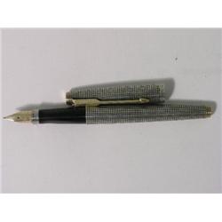 A Parker Ciselle sterling silver fountain pen, finished with grid design, gold clip and flat ends, m