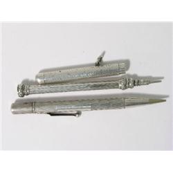 An S. Mordan & Co silver propelling pencil holder, with line and dot engraved finish, another pencil