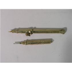A French yellow metal propelling dip pen, with animal mount slider and a propelling pencil  