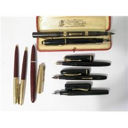 A Waterman's Ideal 52 fountain pen, with gold ring mounts and seven other fountain and ball point pe