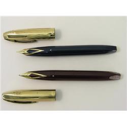A Sheaffer P.f.m.. mark V fountain pen, in burgundy finish and another in blue  