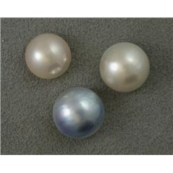 THREE (3) LOOSE MABE PEARLS