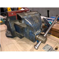 2 blue metal clamps with Irwin 6" bench vise