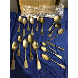 Numerous serving spoons, ladels, etc