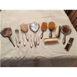 Antique silver personal care items, mirrors, brushes, comb, several items marked "Birks Sterling"