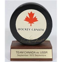 1972 TEAM CANADA PUCK SIGNED BY PAUL HENDERSON.