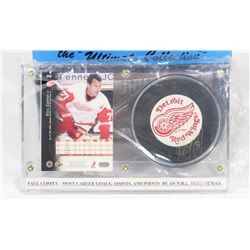 PAUL COFFEY AUTOGRAPHED HOCKEY PUCK IN HOLDER.