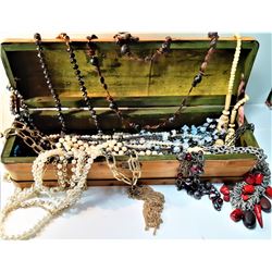 CARVED WOODEN LEAD MOTIF CHEST CONTAINING