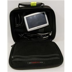 TOMTOM GPS IN ROOTS BAG FOR PARTS.