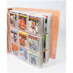 BINDER OF OVER 320 HOCKEY CARDS 1981-1988.