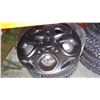 Image 3 : SET OF 4 ULTRA GRIP GOOD YEAR 215/65R15 TIRES ON 5 BOLT RIMS AND 17 INCH RIM COVERS