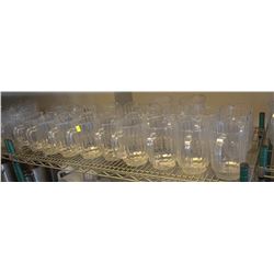 SHELF OF PLASTIC BEER JUGS