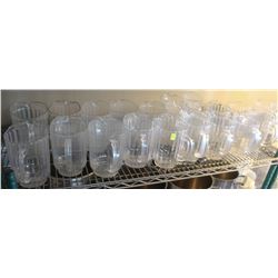 SHELF OF PLASTIC BEER JUGS