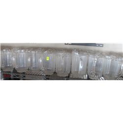 SHELF OF PLASTIC BEER JUGS