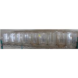 SHELF OF PLASTIC BEER JUGS