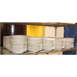SHELF OF OVAL GLASS PLATES