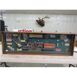 SHADOW BOX OF TRAIN RELATED ARTICLES (46" X 13")