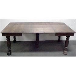 Square oak dining table on ringed and fluted legs;