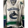 Image 1 : VANCOUVER CANUCKS TEAM SIGNED HOME JERSEY (JSA COA) W/  HORVAT/ BROCK BOESSER/ DANIEL & HENRIK SEDIN