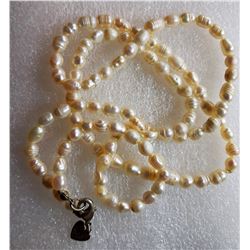 7) AEO 26 STRAND OF FRESHWATER PEARLS.