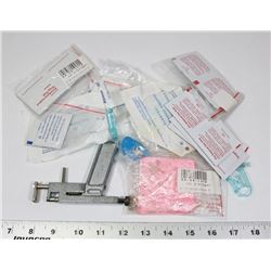 PIERCING GUN WITH EARRINGS IN BAG