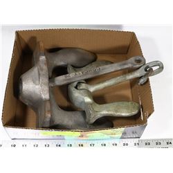 BOX W/ TWO BOAT ANCHORS.