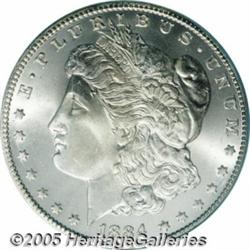 1884-CC $1 MS67 PCGS. An 1884-CC Morgan dollar, p