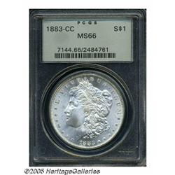 1883-CC S$1 MS66 PCGS. A frosty-white Gem, both s