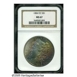 1884-CC S$1 MS67 NGC. Wide swaths of rainbow irid