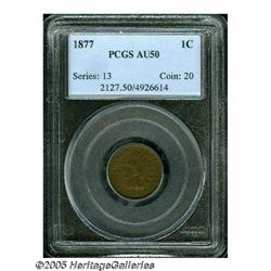 1877 1C AU50 PCGS. Medium brown surfaces are semi