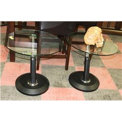 PAIR OF ROUND GLASS TOP BLACK BASE END TABLES.