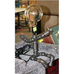PIPE BASED LAMP MAN WITH NO SHADE.