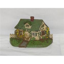 CAST IRON COTTAGE DOORSTOP