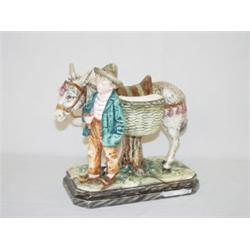 9" CONTINENTAL MAJOLICA FIGURE OF BOY W/ DONKEY (PROF. REPAIR)