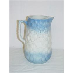8 1/2" BLUE & WHITE STONEWARE PITCHER W/ BASKETWEAVE DESIGN & EMBOSSED FLOWERS