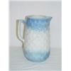 Image 1 : 8 1/2" BLUE & WHITE STONEWARE PITCHER W/ BASKETWEAVE DESIGN & EMBOSSED FLOWERS