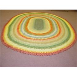 LG. OVAL HAND BRAIDED RUG (11' X 14')