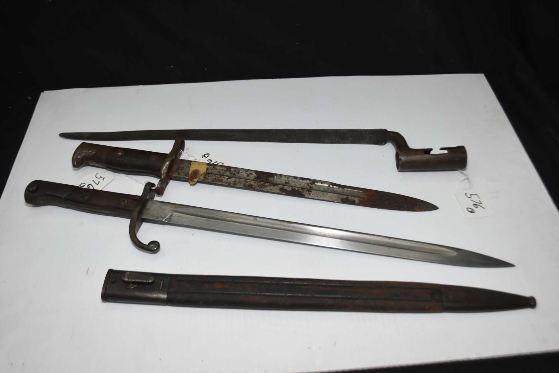 Three Vintage Rifle Bayonets One With Scabbard three-vintage-rifle-bayonets-one-with-scabbard