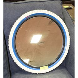 TIRE FRAMED MIRROR.