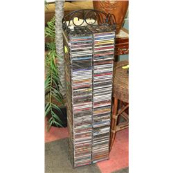 CD RACK WITH OVER 180 CDS.