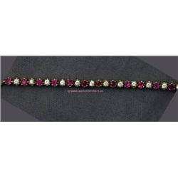 14 K YELLOW GOLD LADIES TENNIS STYLE BRACELET SET WITH 28 RUBY STONES 1.4 CT.  7.9 GRAMS.