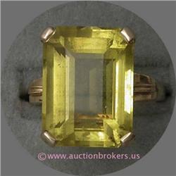 14 K YELLOW GOLD LADIES GEMSTONE RING SET WITH AN EMERALD CUT YELLOW TOPAZ STONE APPROXIMATELY 7 X 1