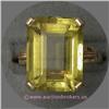 Image 1 : 14 K YELLOW GOLD LADIES GEMSTONE RING SET WITH AN EMERALD CUT YELLOW TOPAZ STONE APPROXIMATELY 7 X 1